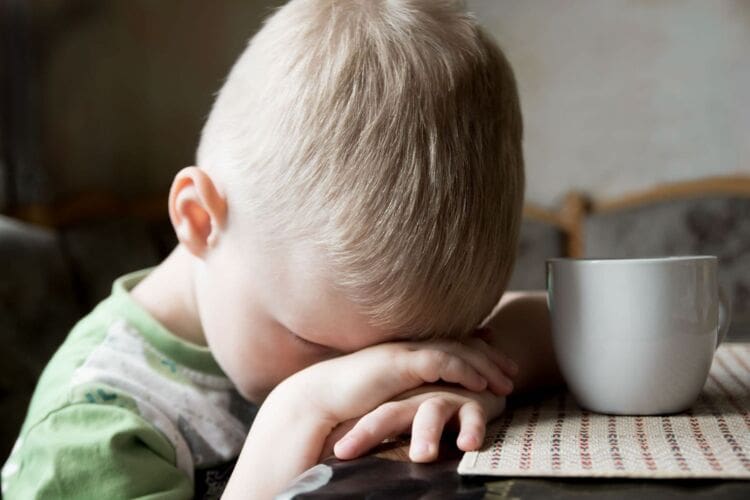 Upset little boy suffering a type of abuse