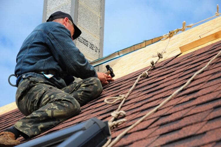 Man working at height on a roof