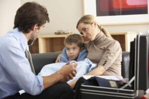 Mother with son talking to the doctor as she is concerned he has ADHD