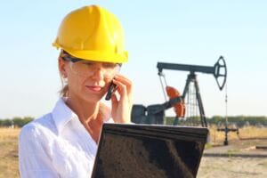 Woman on the phone making RIDDOR report
