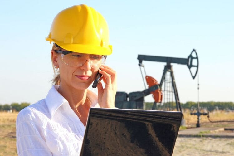 Woman on the phone making RIDDOR report