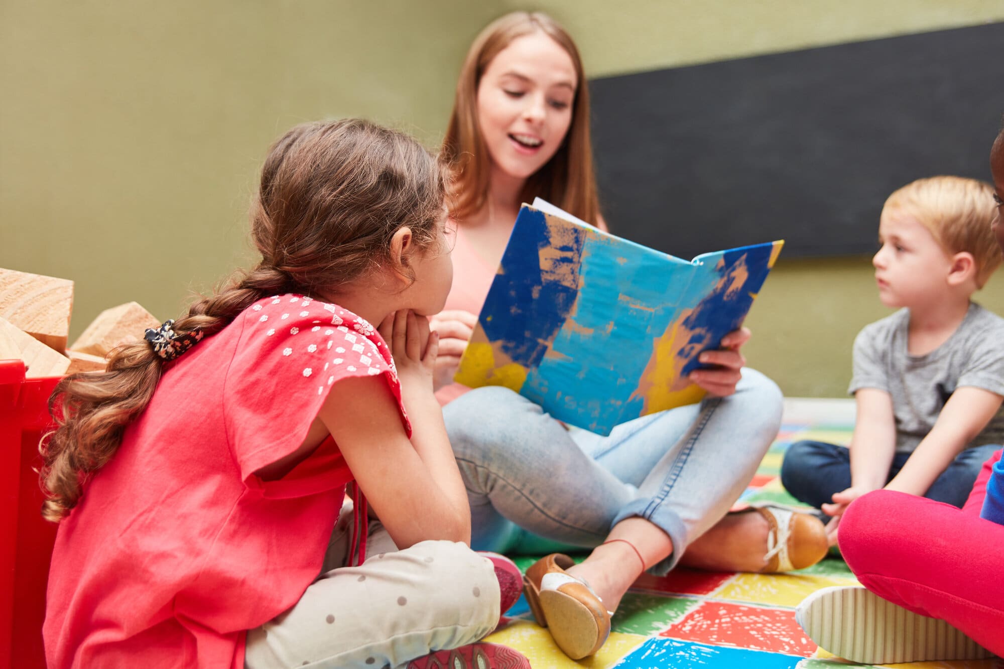 Student childminder volunteering with children