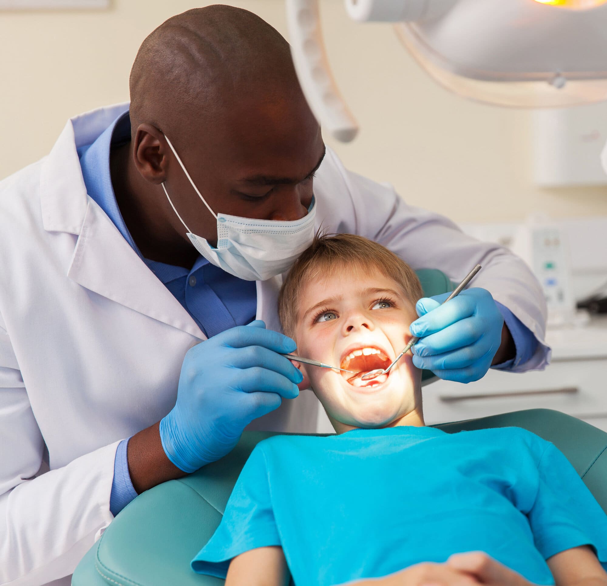 Dentist working with child