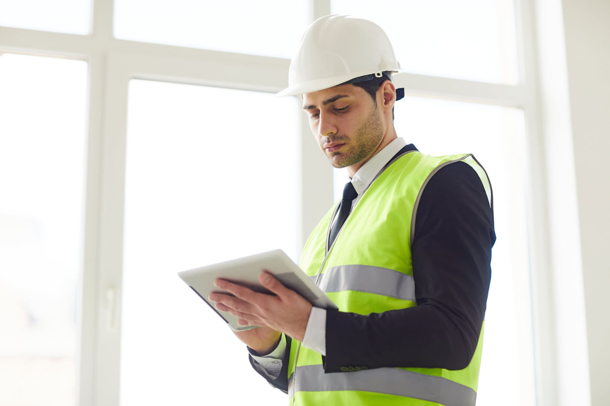 Health and safety inspector working on building site