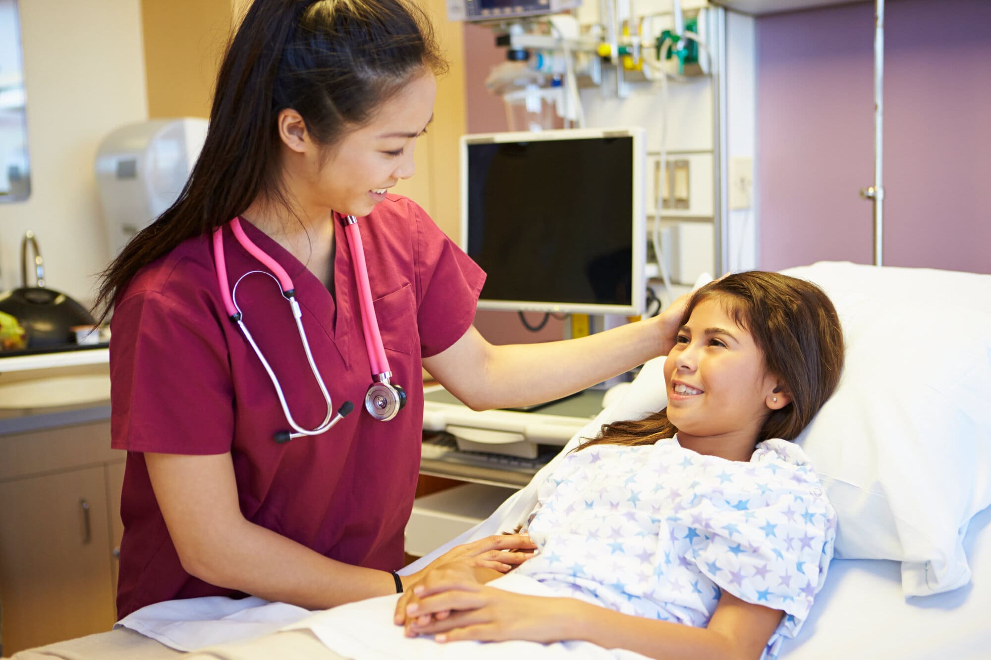 Trainee nurse volunteering in children's ward