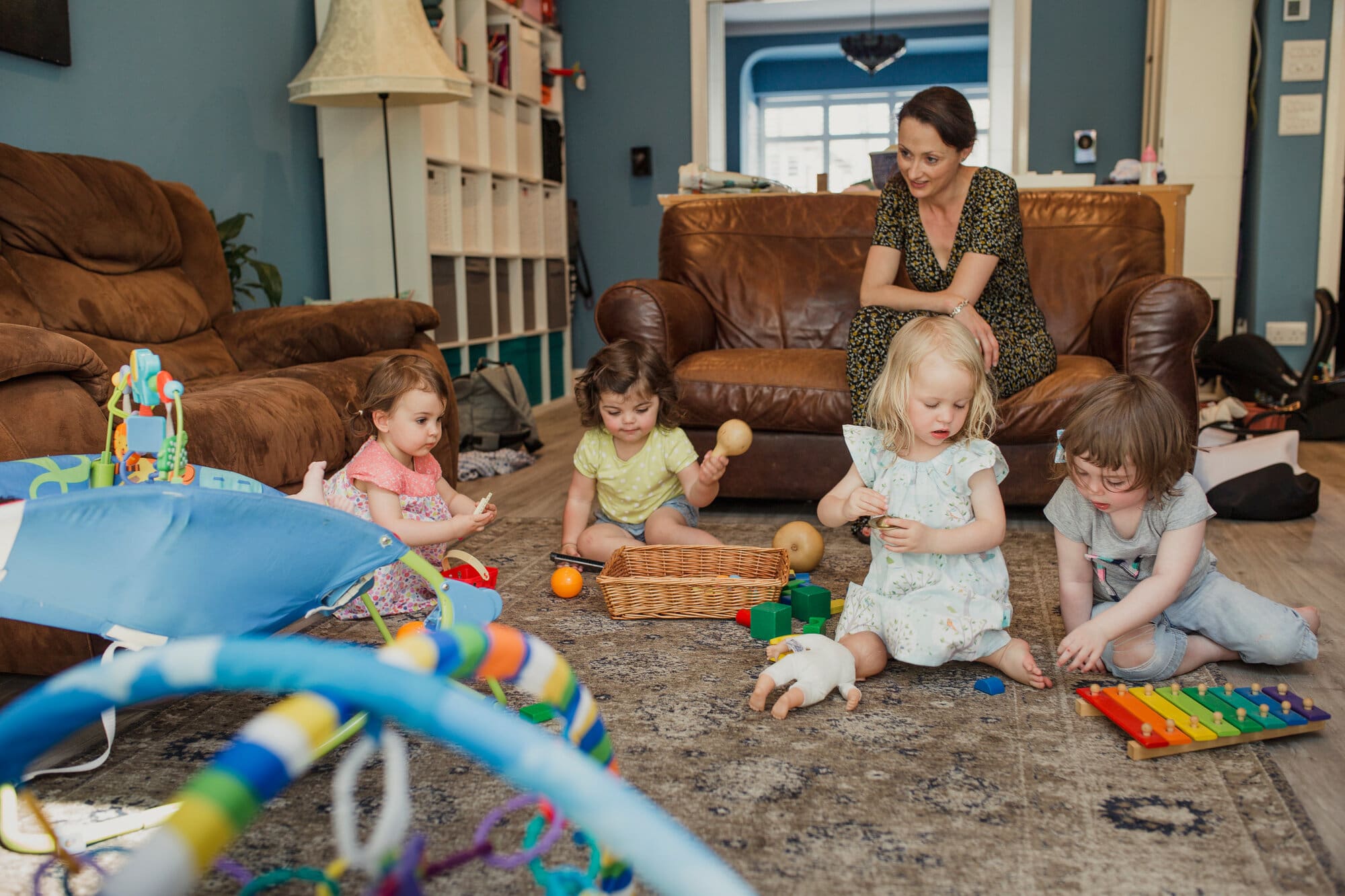 Childminder working from home looking after toddlers