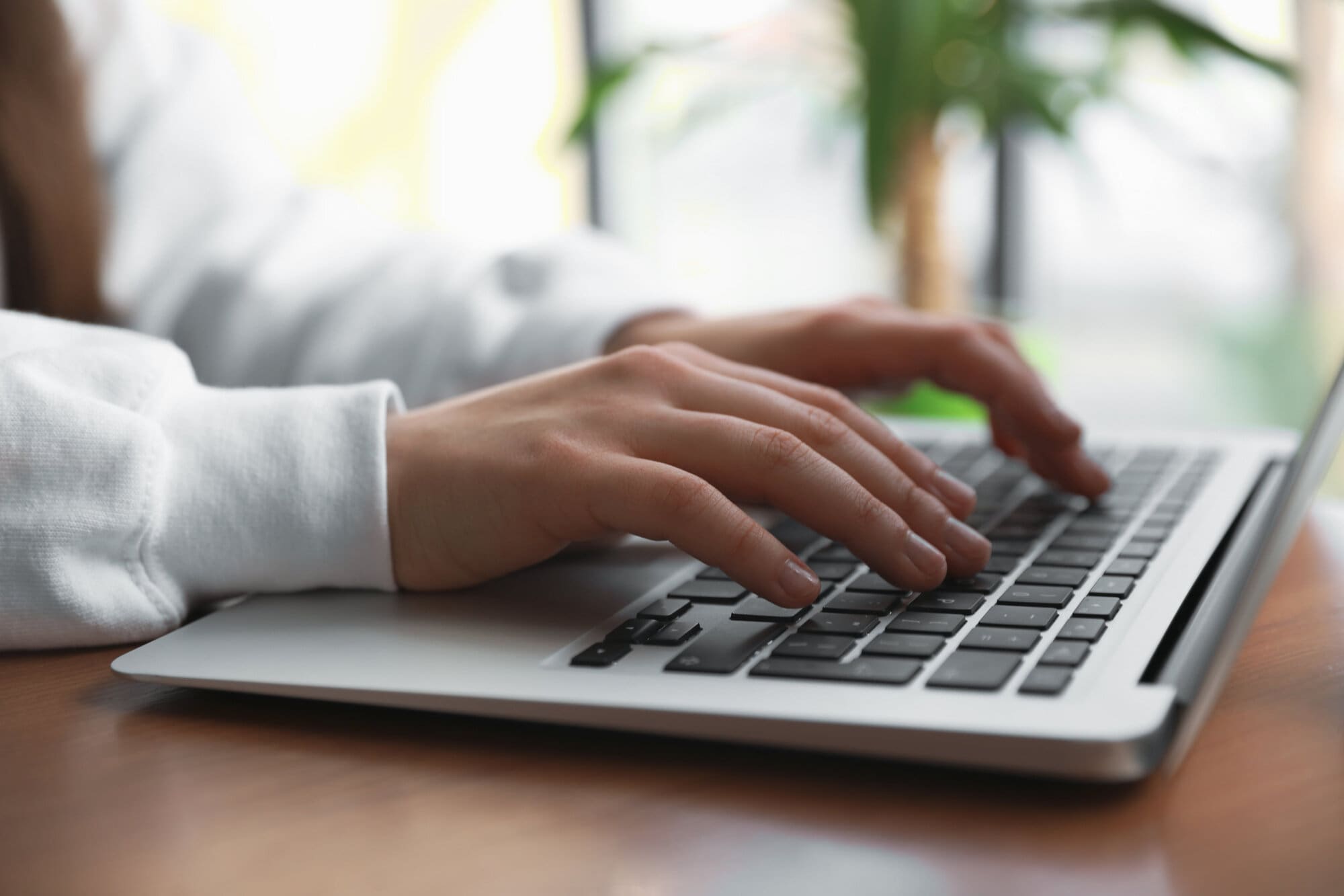 Social worker completing training at home on laptop
