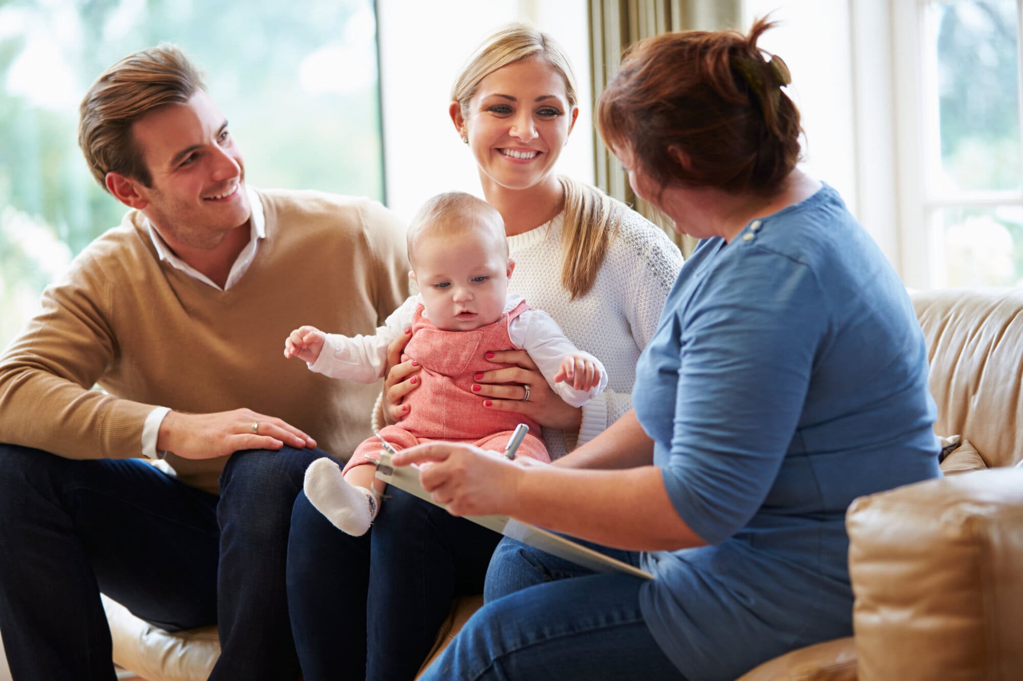 Social worker assisting new parents