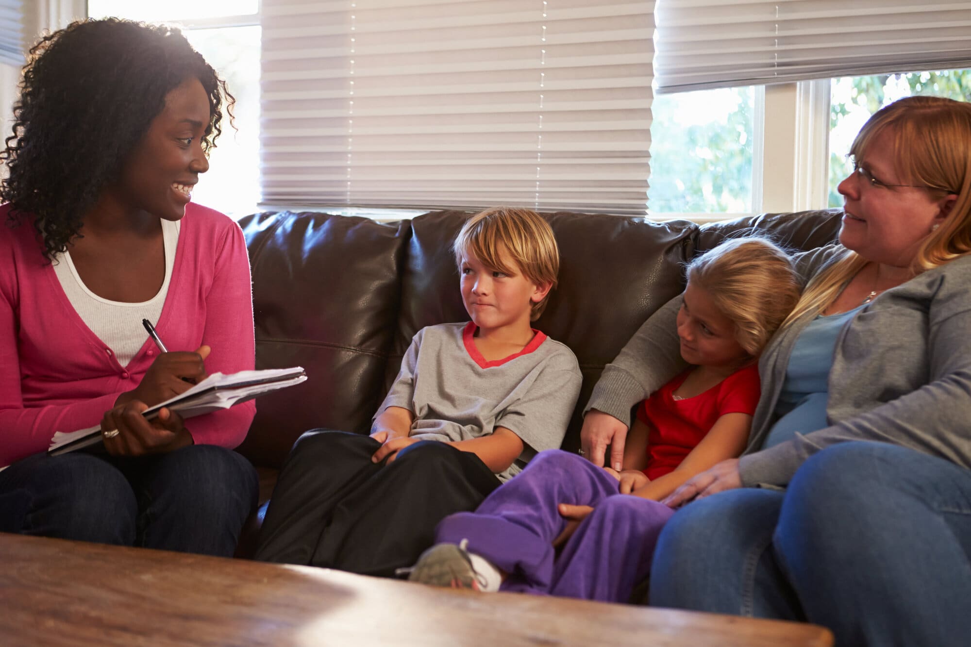 Social worker visiting vulnerable family