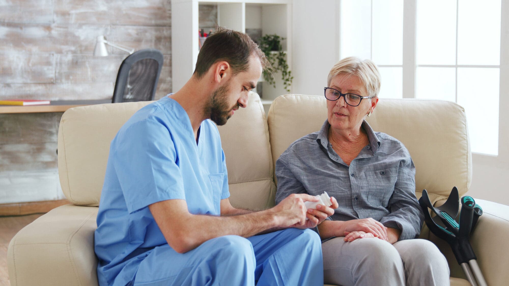 Nurse in health and social care with elderly woman Nurse in health and social care with elderly woman