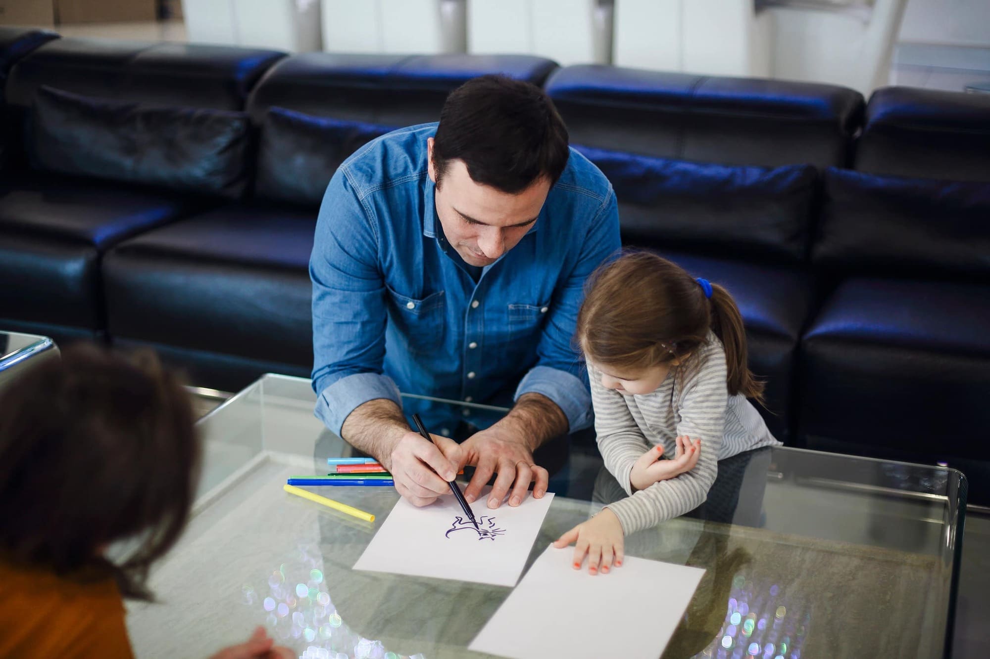 Childminder doing art with child