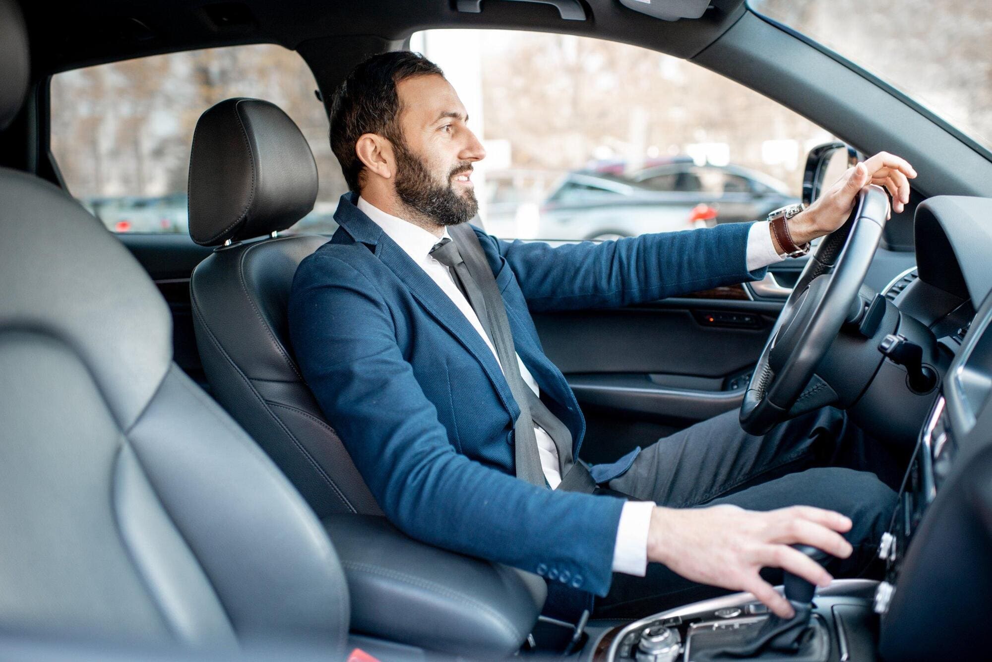 Broker driving to meet clients early morning