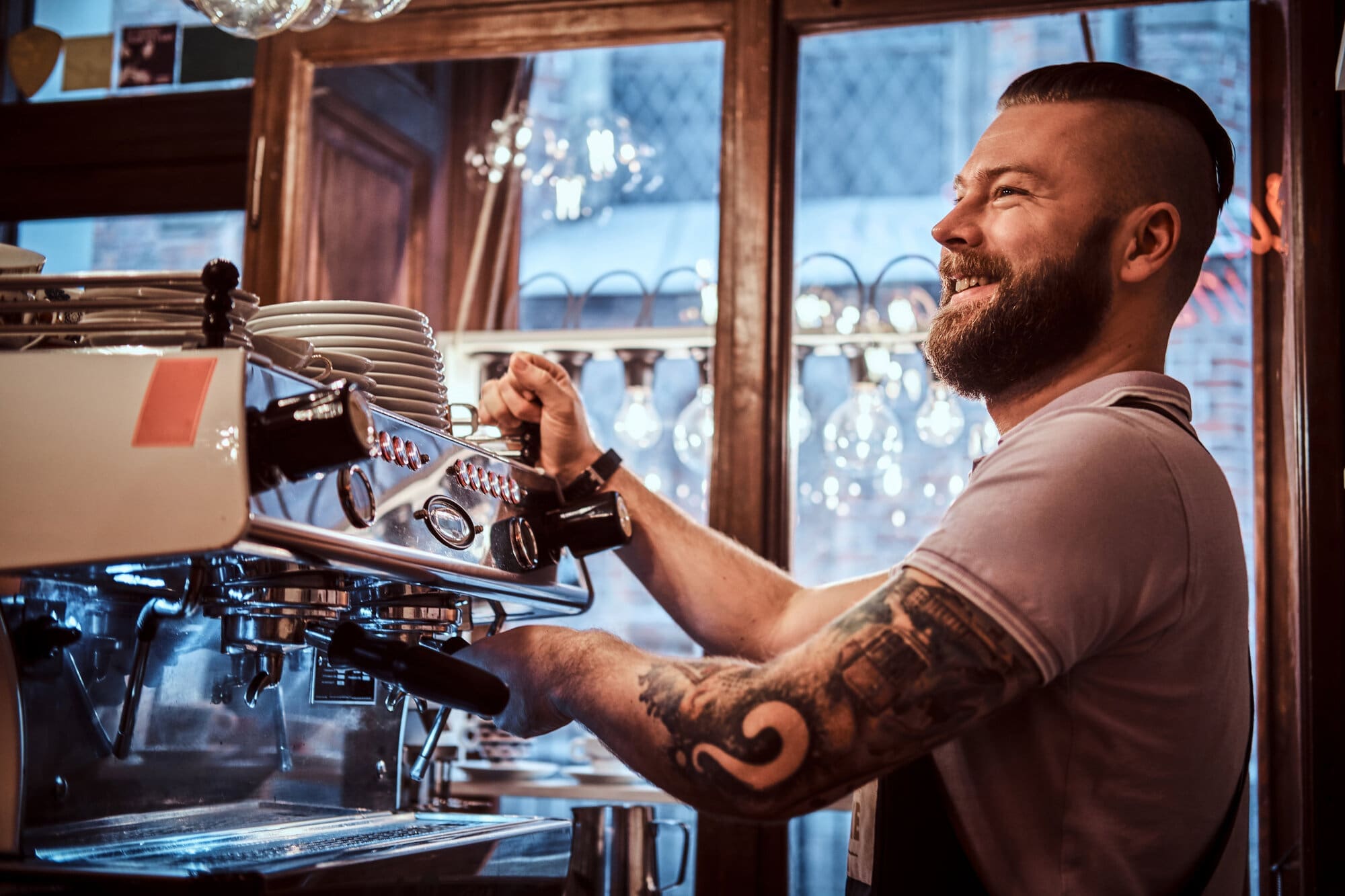 Coffee shop barista making fresh coffee