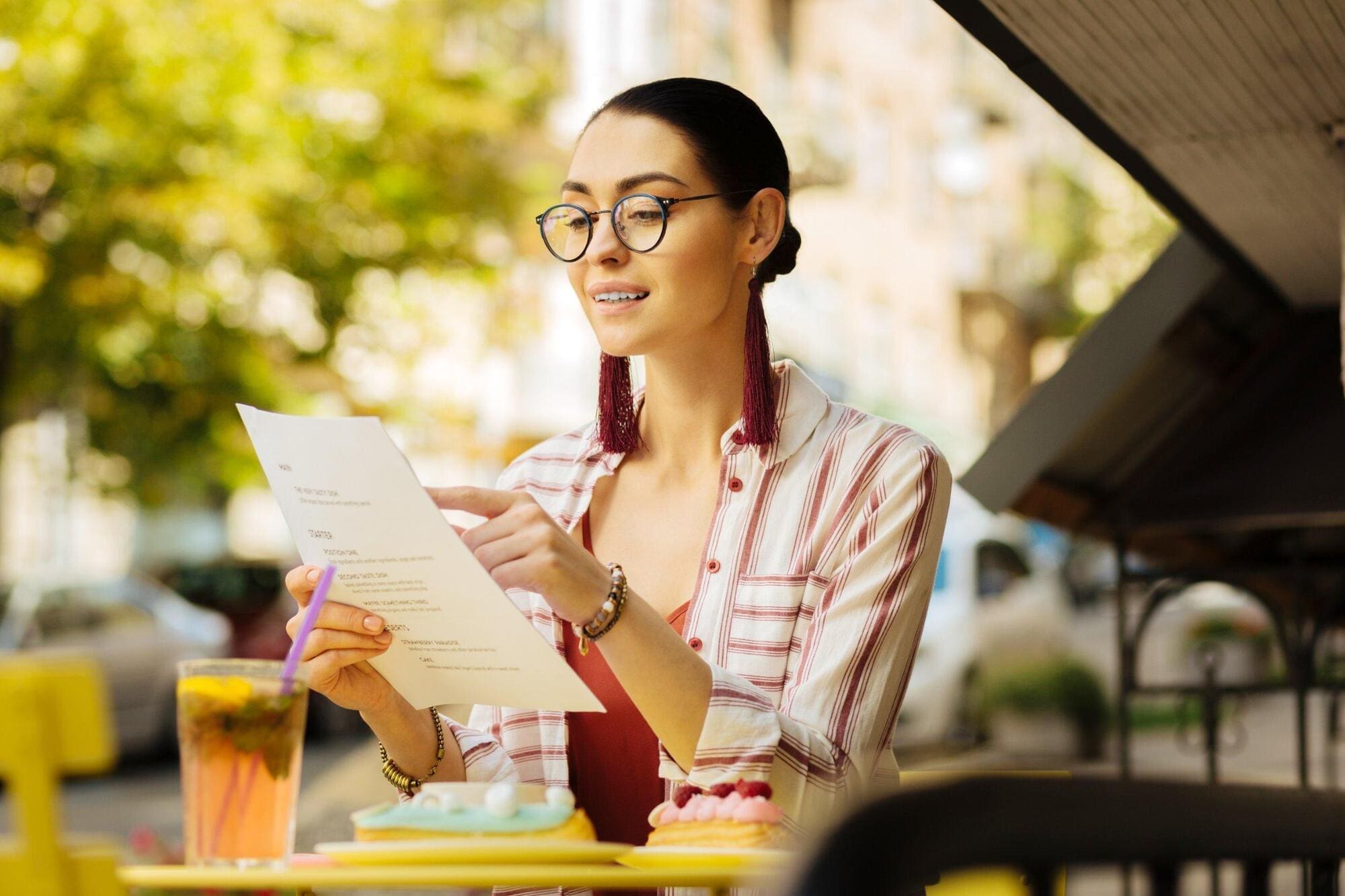 Food critic reading menu of new food establishment
