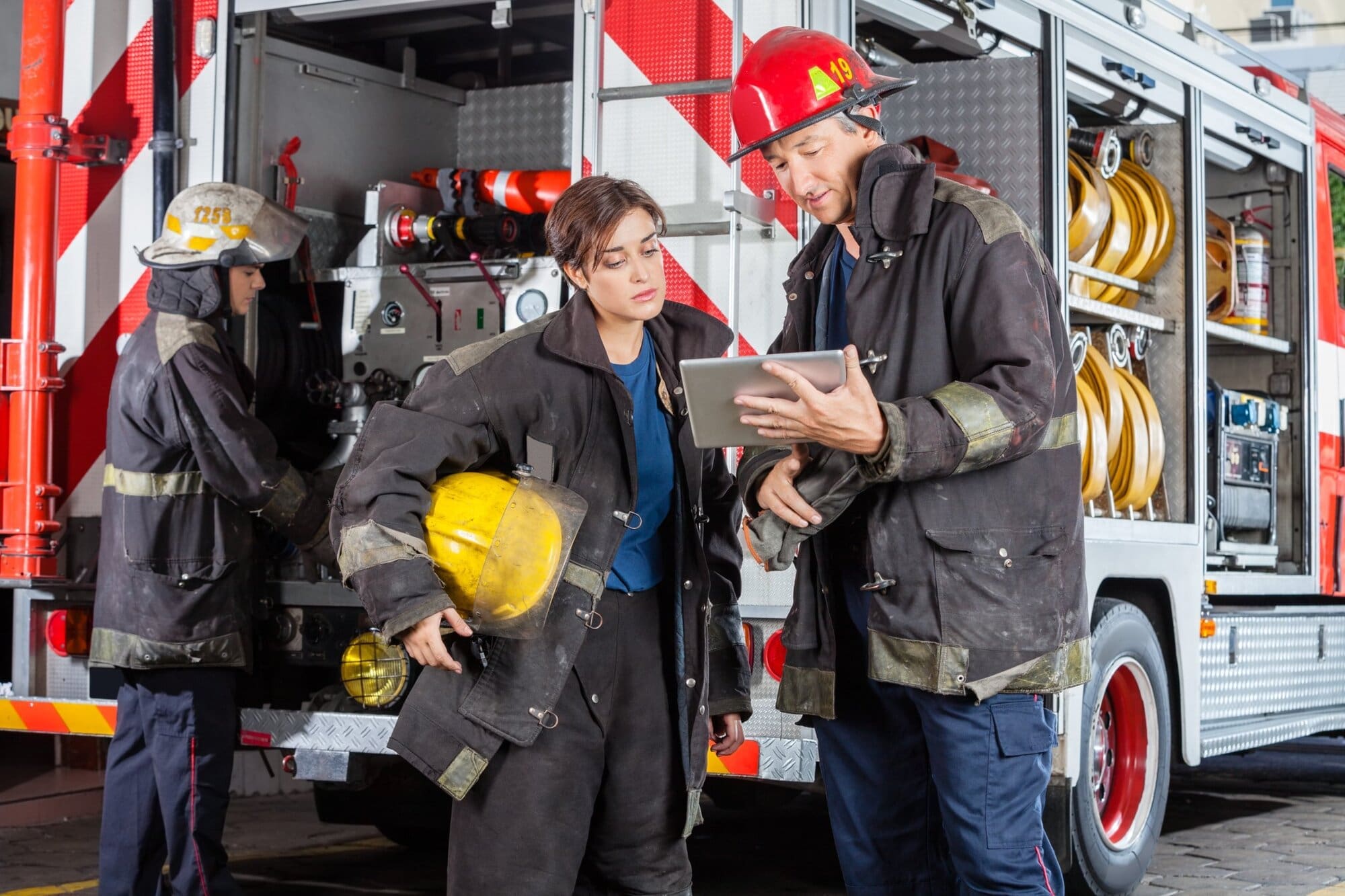 Young woman doing work experience with the fire department
