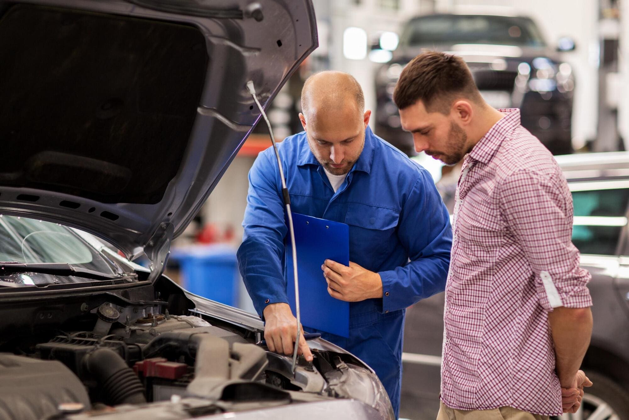 Mechanic speaking to customer