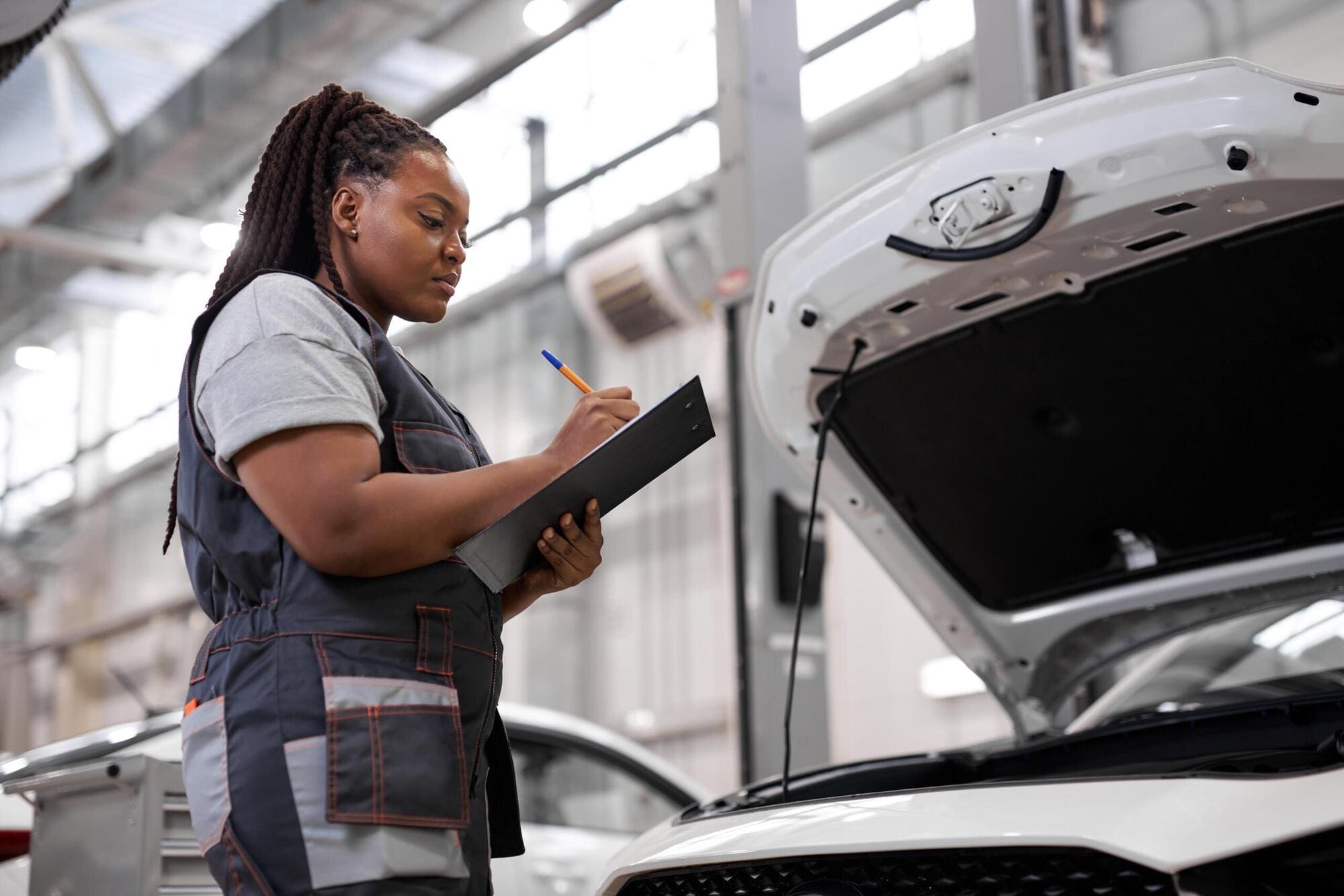 Mechanic working at car repair company