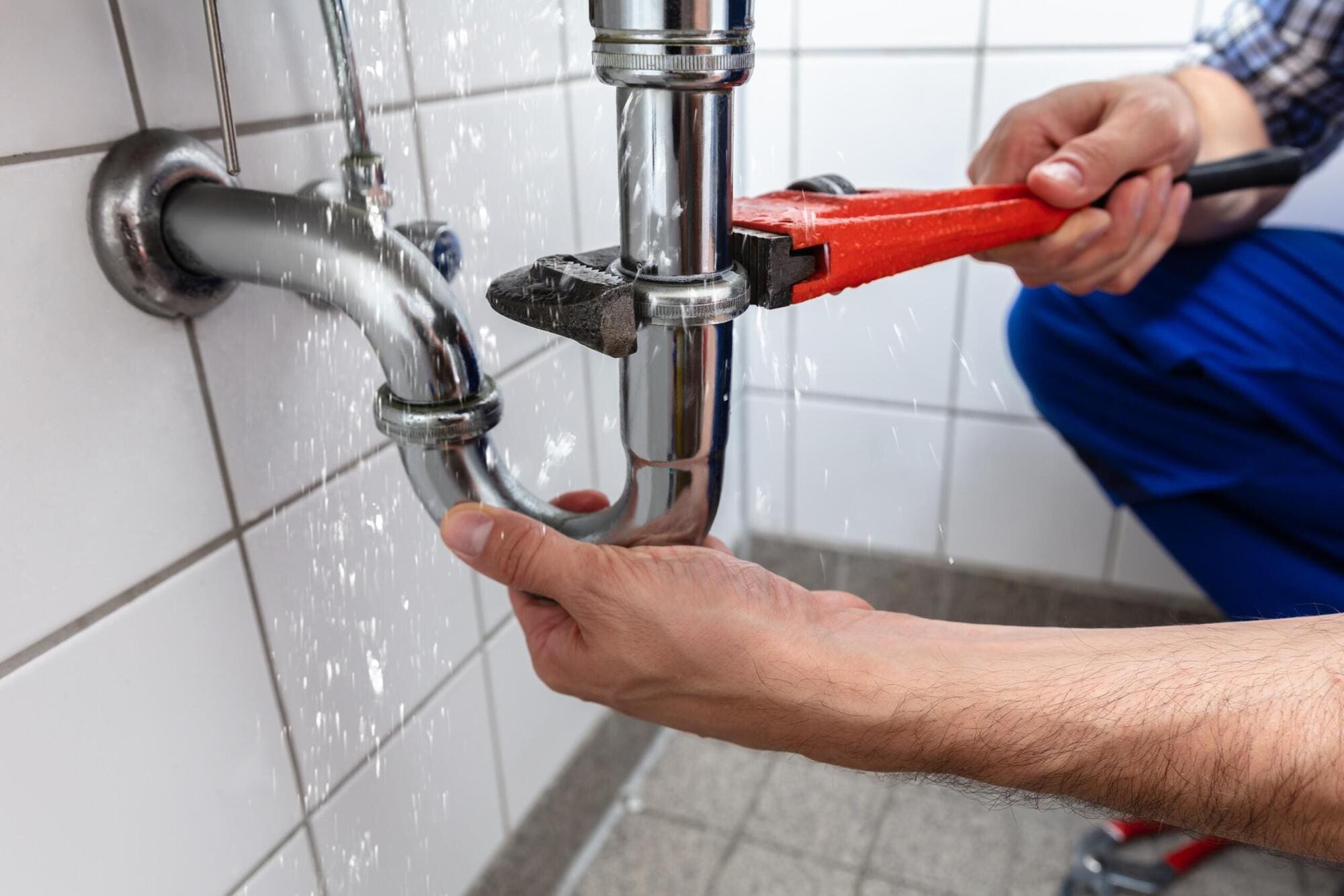 Emergency plumber fixing burst pipework