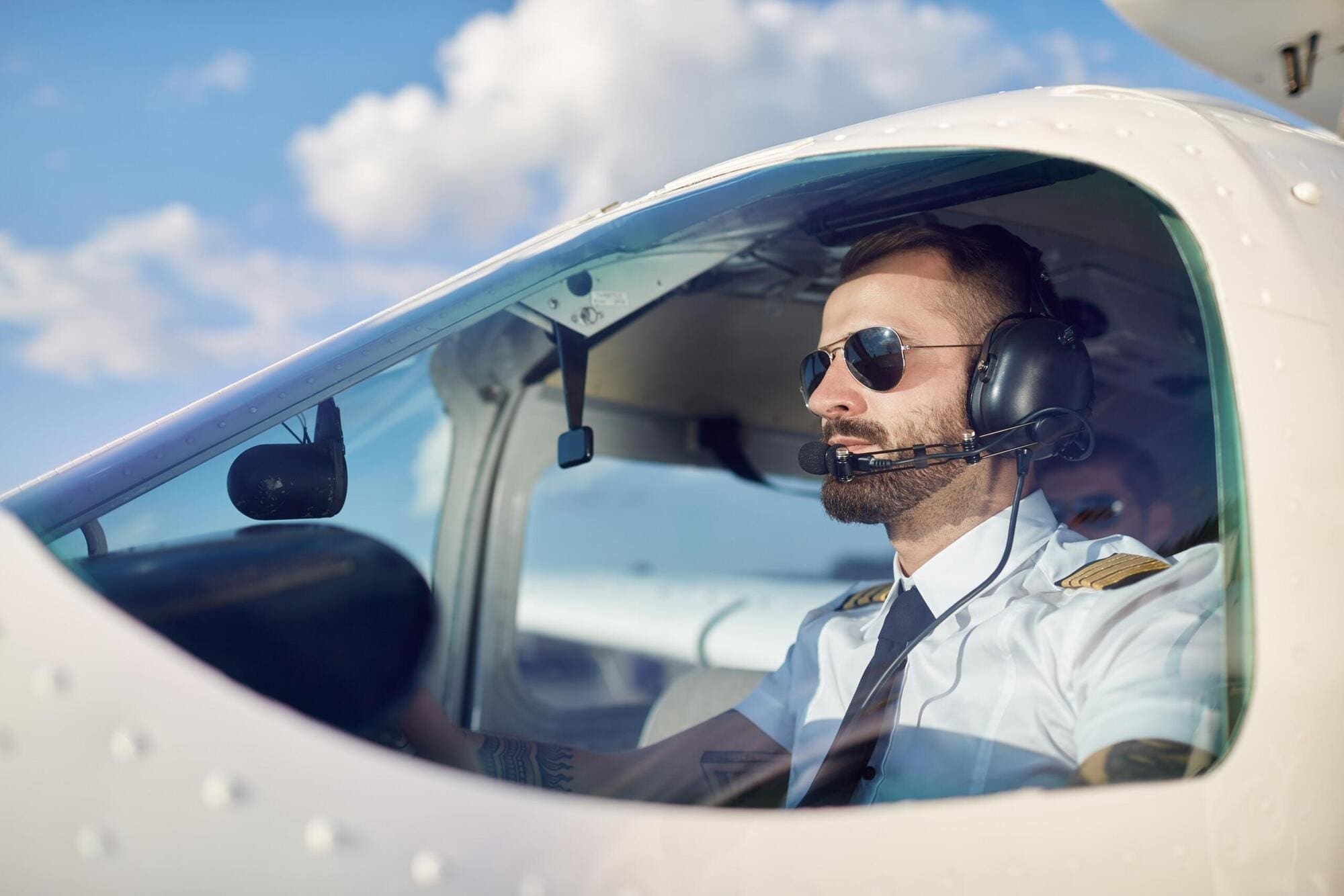 Airline pilot working on commercial airline Airline pilot working on commercial airline
