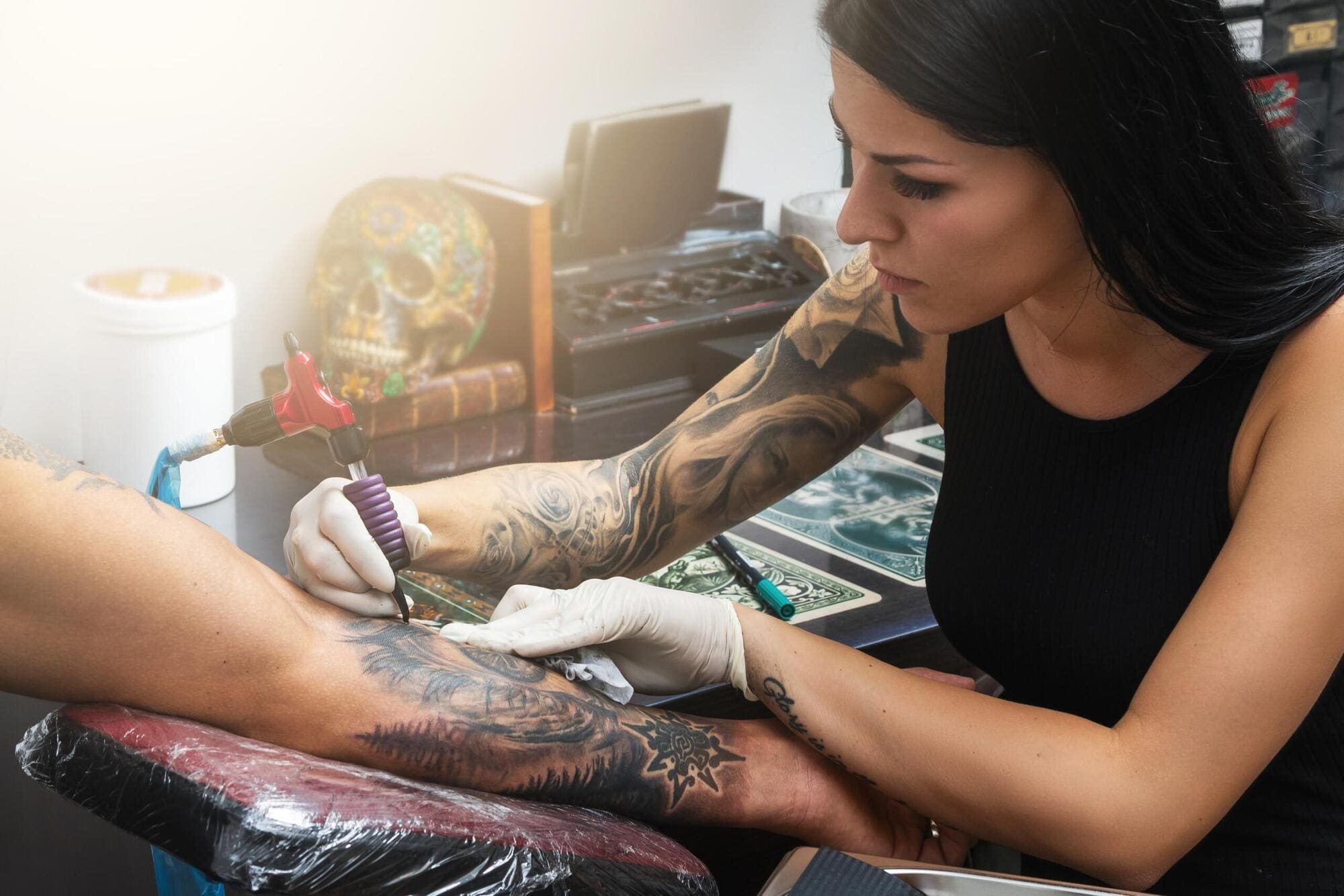 Tattoo artist working after completing training courses