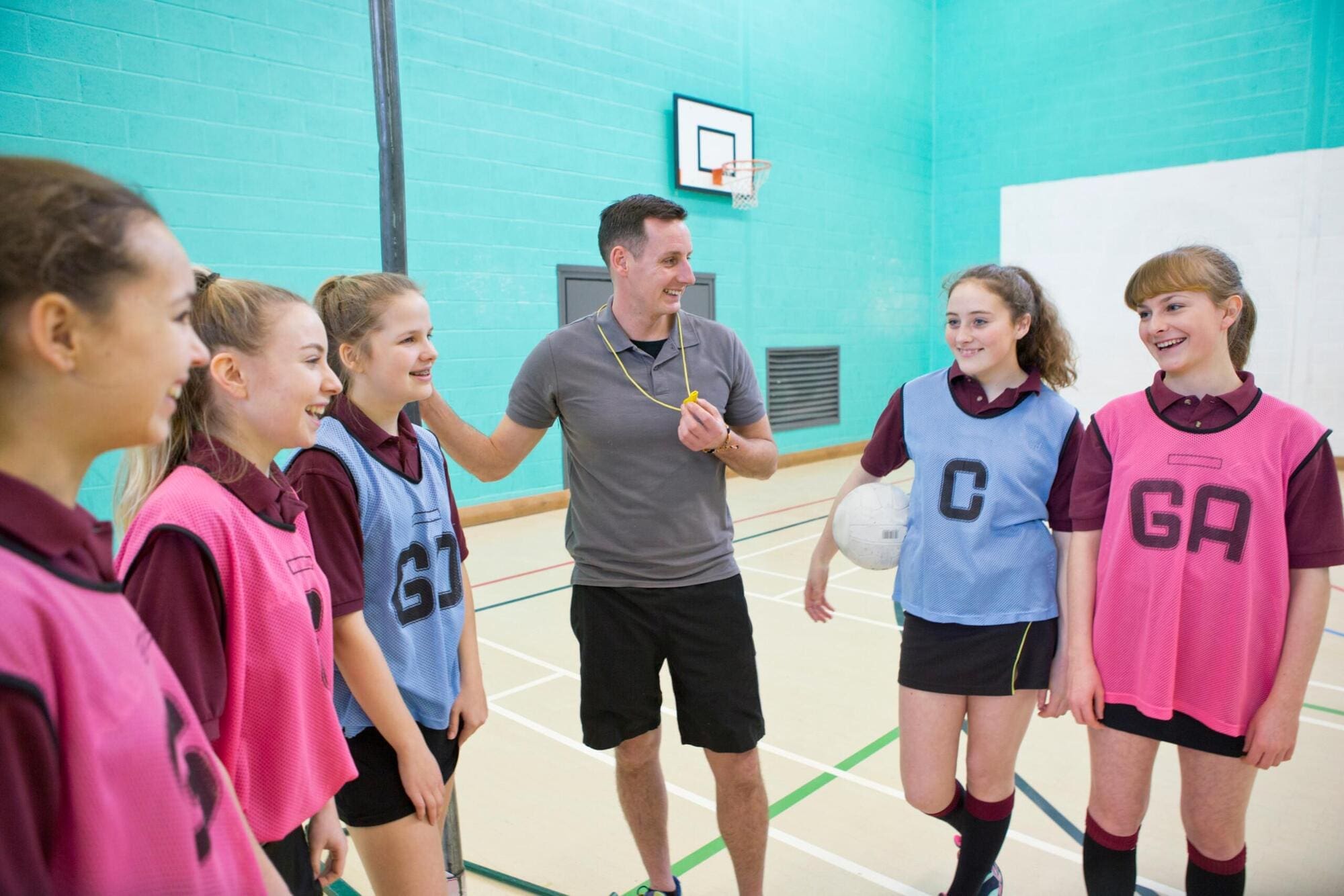 Youth worker encouraging sports activities