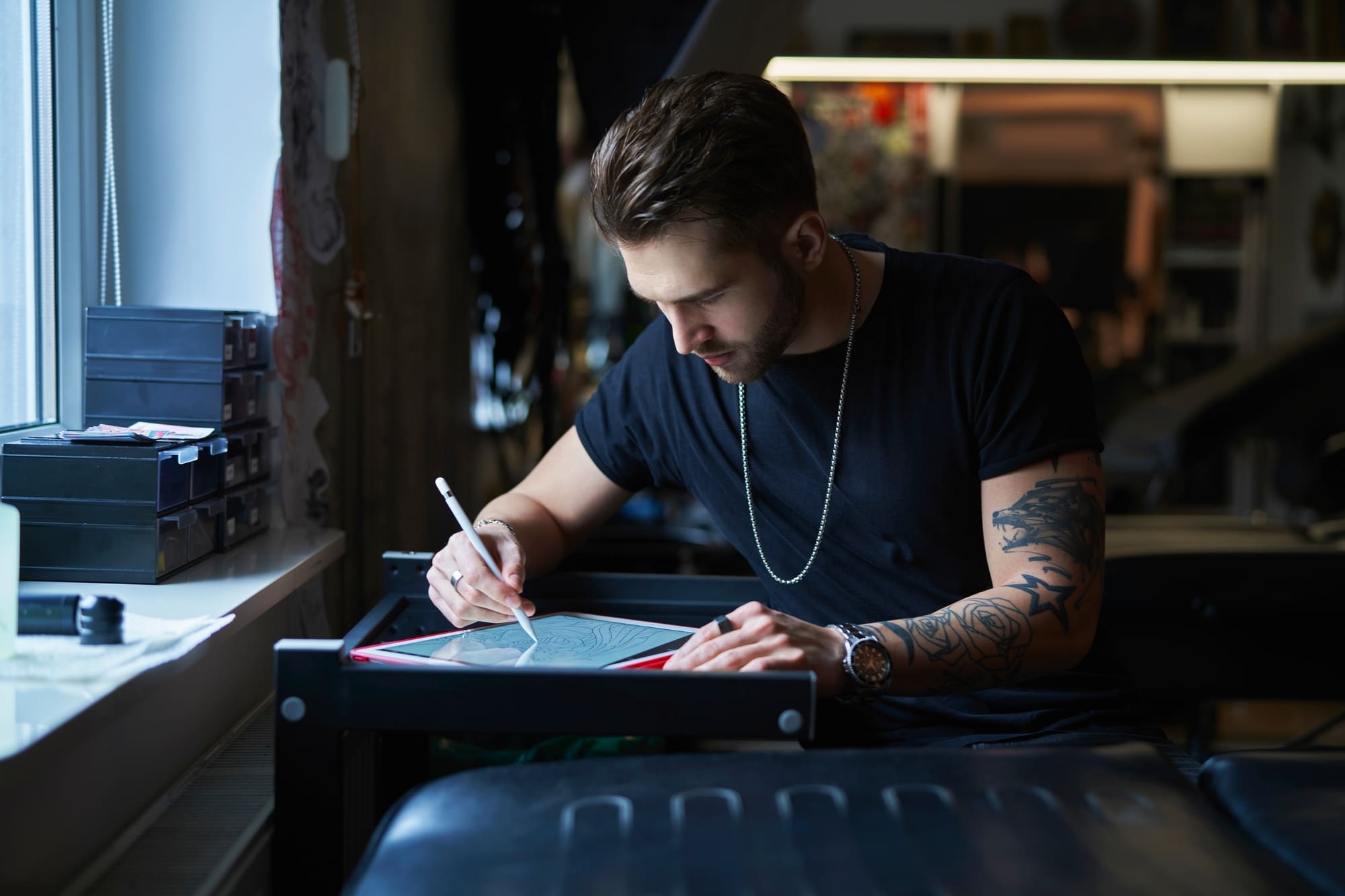 Tattoo artist keeping up to date with tattoo trends