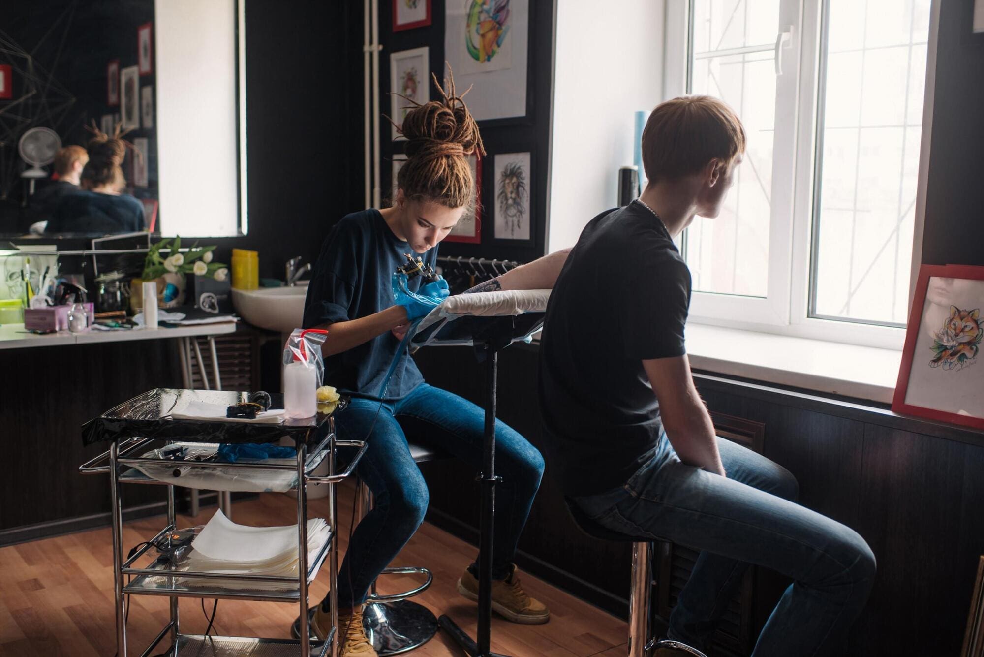 Tattoo artist working in tattoo studio