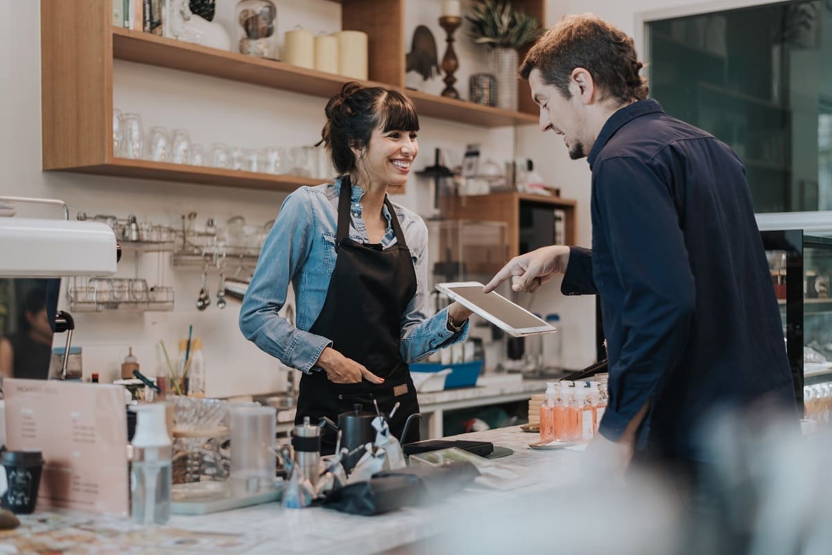 Barista taking payment