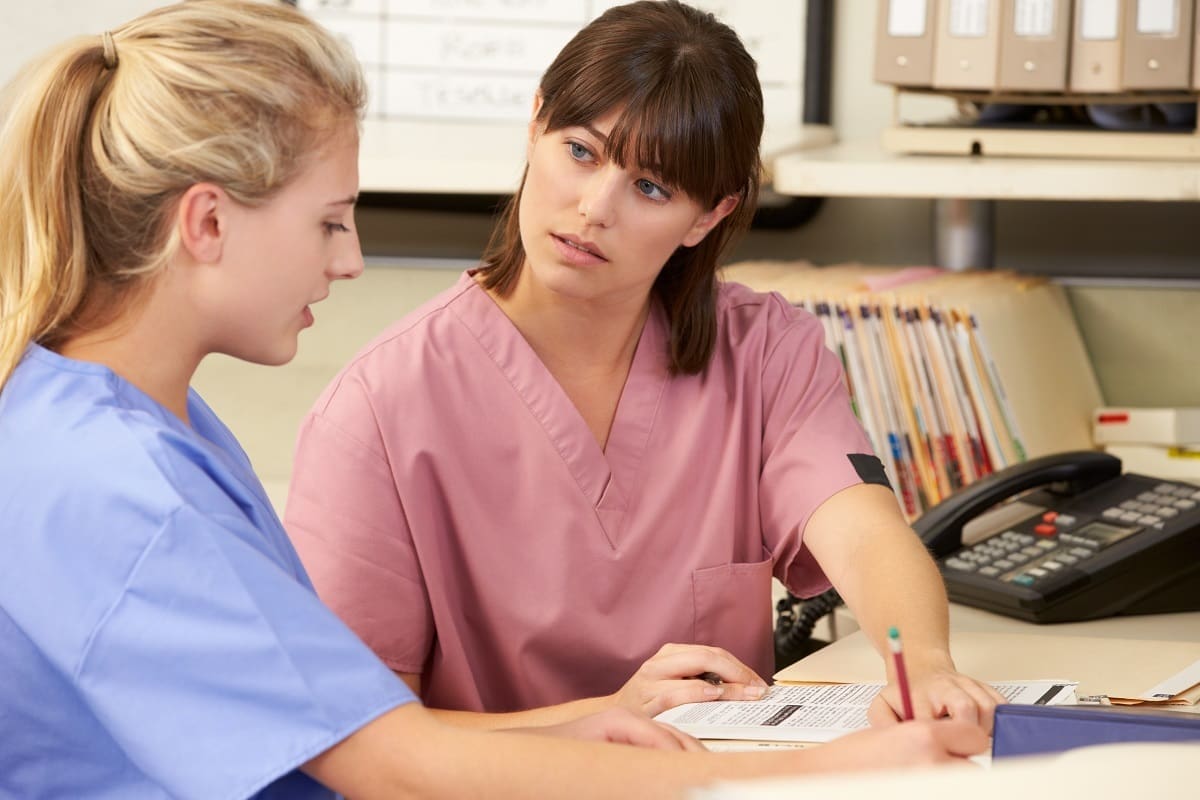 Dental nurse talking to designated safeguarding lead