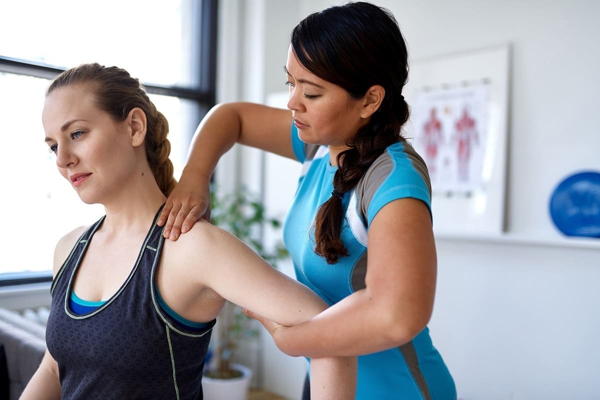 Chiropractor working in sport facility