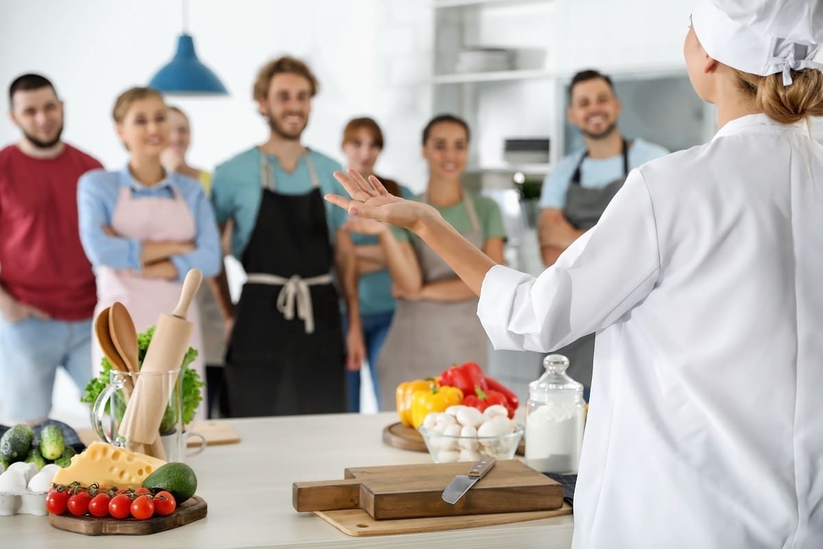 Attending practical course cooking lesson