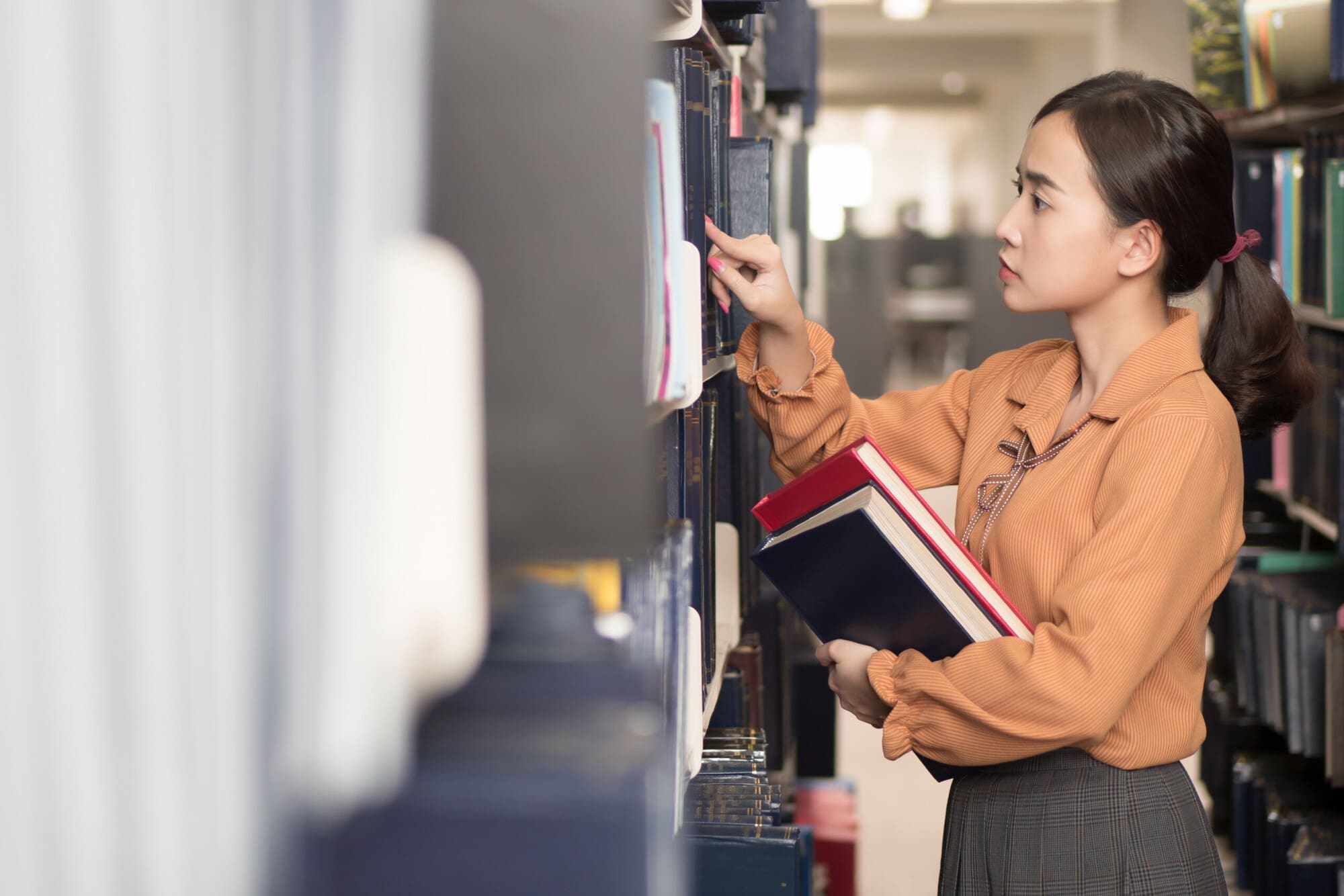 Librarian Finding Book