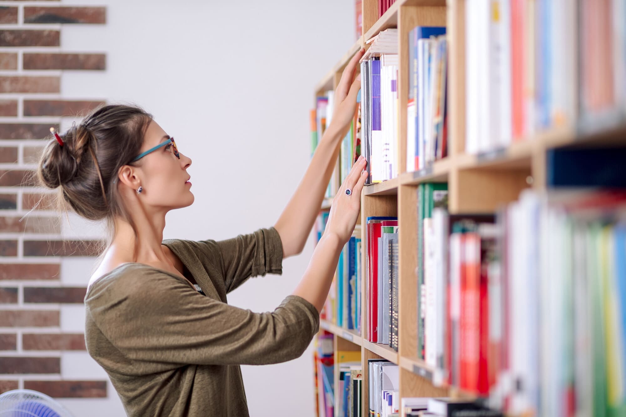 Librarian Sorting Books