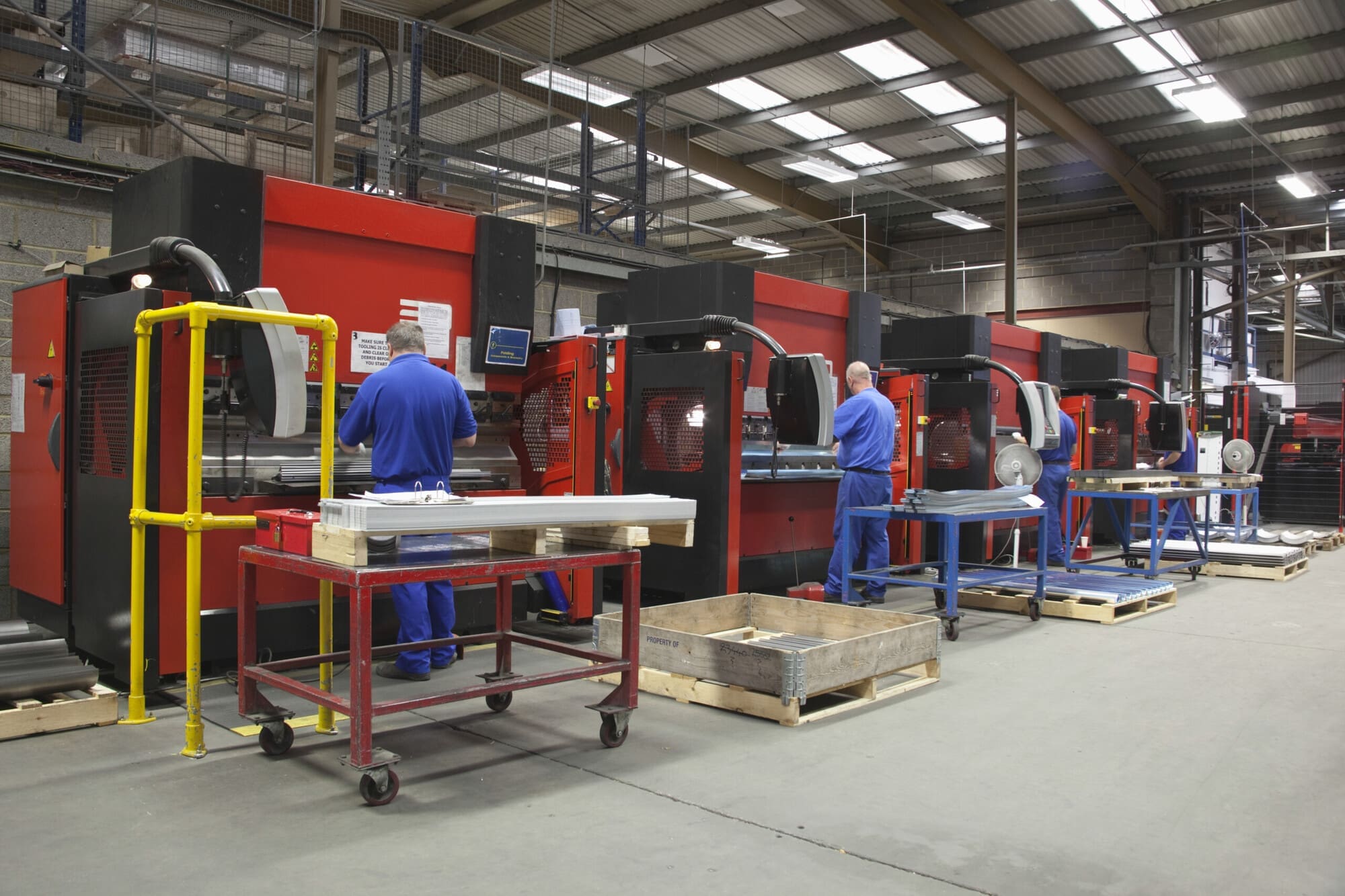 Warehouse Machinery Being Operated By Warehouse Operatives