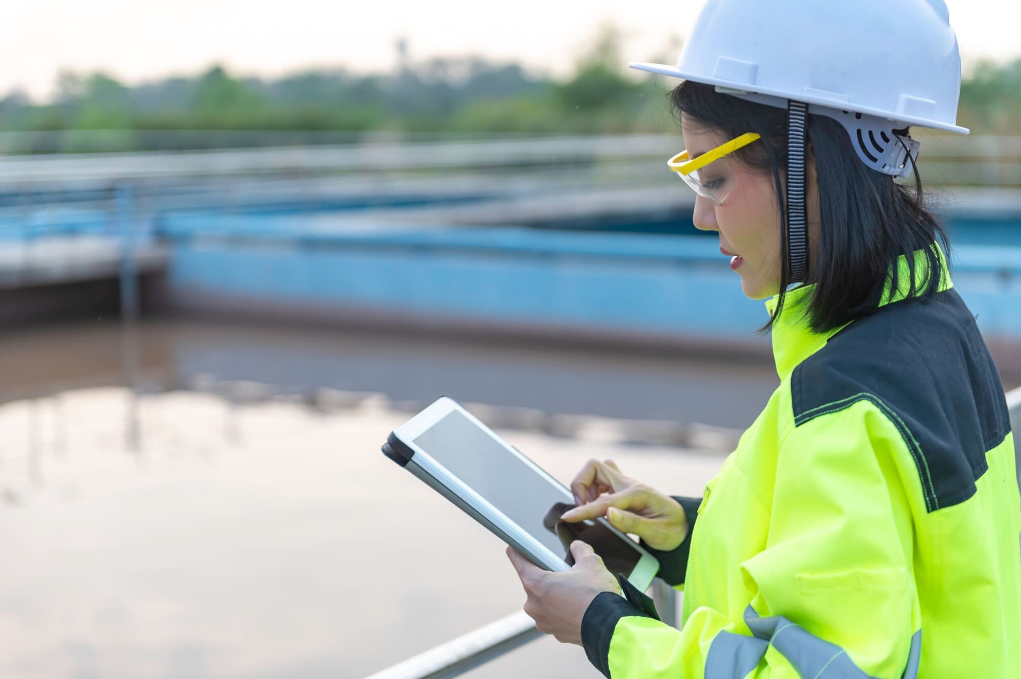 Sewage worker doing health and safety checks